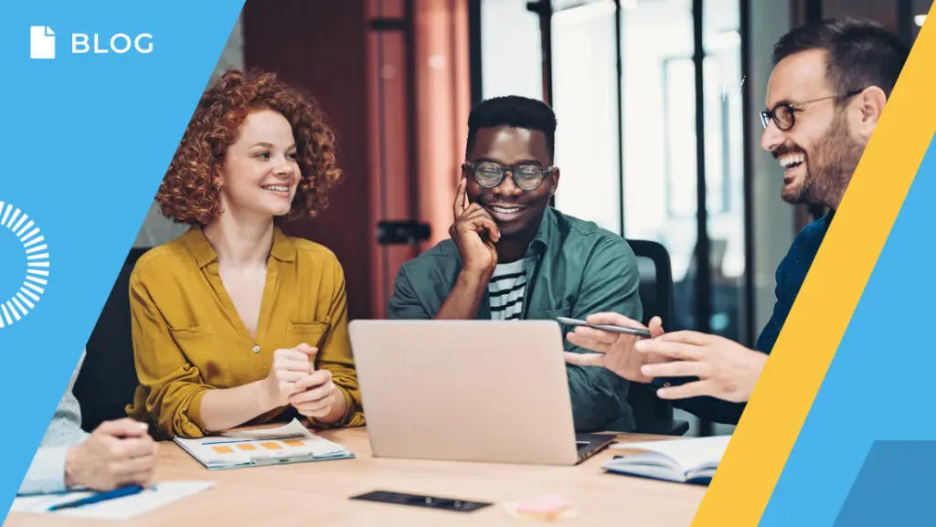 A group of four people sits around a table with a laptop, smiling and engaged in conversation, analyzing the 2024 CS Index. The setting appears to be an EMEA office. Blue and yellow graphic elements frame the image's corners, with a 