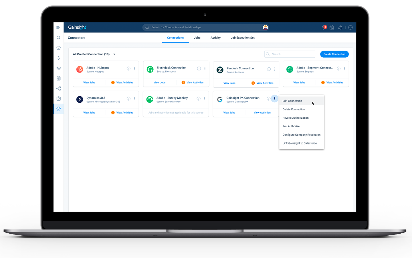 A laptop displaying a user interface for managing software connections on a dynamic platform. The screen includes several connection options such as Adobe, Zendesk, and Gainsight. There are buttons for viewing jobs and actions like editing or removing connections.